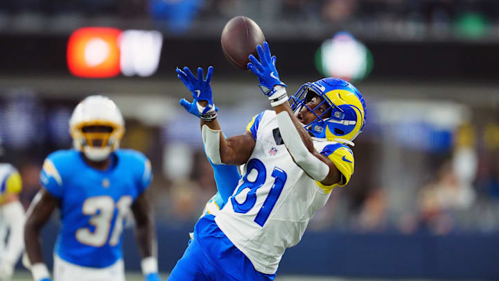 Aug 16, 2025; Inglewood, California, USA; iLos Angeles Rams wide receiver Brennan Presley (81) attempts to catch the ball against Los Angeles Chargers cornerback Nikko Reed (46) in the second half at SoFi Stadium. Mandatory Credit: Kirby Lee-Imagn Images
