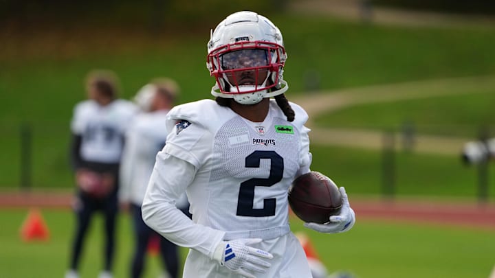 Oct 18, 2024; London, United Kingdom; New England Patriots wide receiver K.J. Osborn (2) carries the ball during practice at the Harrow School. Oct 18, 2024; London, United Kingdom; New England Patriots wide receiver K.J. Osborn (2) carries the ball during practice at the Harrow School.
