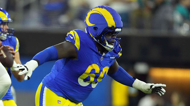Nov 11, 2024; Inglewood, California, USA; Los Angeles Rams guard Kevin Dotson (69) wears a Guardian helmet cap in the second half against the Miami Dolphins at SoFi Stadium. Mandatory Credit: Kirby Lee-Imagn Images