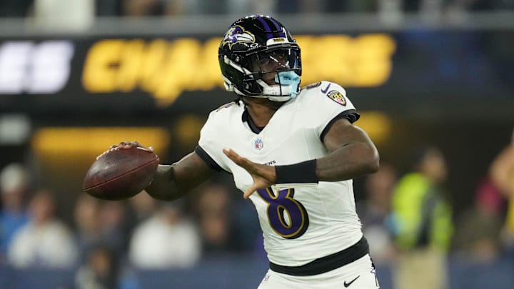 Nov 25, 2024; Inglewood, California, USA; Baltimore Ravens quarterback Lamar Jackson (8) throws the ball against the Los Angeles Chargers in the first half at SoFi Stadium.