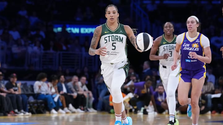 Jun 17, 2025; Los Angeles, California, USA; Seattle Storm forward Gabby Williams (5) dribbles the ball against LA Sparks forward Dearica Hamby (5) in the second half at Crypto.com Arena. Mandatory Credit: Kirby Lee-Imagn Images