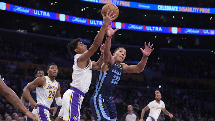 Dec 15, 2024; Los Angeles, California, USA; Los Angeles Lakers guard Max Christie (12) and Memphis Grizzlies guard Desmond Bane (22) reach for the ball in the first half at Crypto.com Arena. Mandatory Credit: Kirby Lee-Imagn Images Dec 15, 2024; Los Angeles, California, USA; Los Angeles Lakers guard Max Christie (12) and Memphis Grizzlies guard Desmond Bane (22) reach for the ball in the first half at Crypto.com Arena. Mandatory Credit: Kirby Lee-Imagn Images