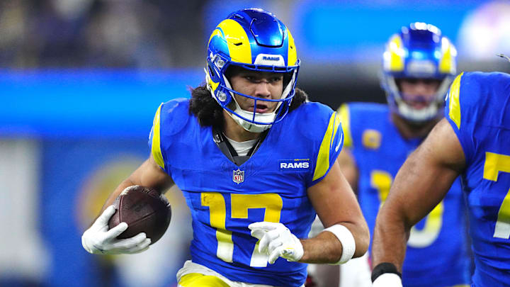 Dec 28, 2024; Inglewood, California, USA; Los Angeles Rams wide receiver Puka Nacua (17) carries the ball against the Arizona Cardinals in the second half at SoFi Stadium. Mandatory Credit: Kirby Lee-Imagn Images