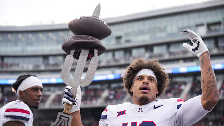 Nov 15, 2025; Cincinnati, Ohio, USA;  Arizona Wildcats defensive back Dalton Johnson (43) celebrates on the sidelines after intercepting a pass against the Cincinnati Bearcats in the first half at Nippert Stadium. Mandatory Credit: Aaron Doster-Imagn Images