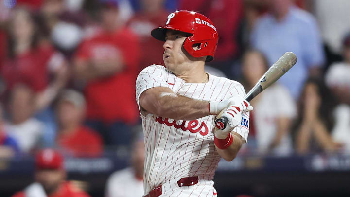 Philadelphia Phillies catcher J.T. Realmuto (10) hits a double against the Los Angeles Dodgers in the ninth inning during game two of the NLDS round for the 2025 MLB playoffs at Citizens Bank Park. 