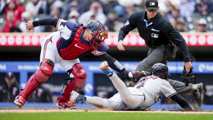 Apr 4, 2024; Minneapolis, Minnesota, USA; Minnesota Twins catcher Christian Vazquez (8) tags out Cleveland Guardians shortstop Brayan Rocchio (4) during the fifth inning at Target Field. Mandatory Credit: Jordan Johnson-USA TODAY Sports Apr 4, 2024; Minneapolis, Minnesota, USA; Minnesota Twins catcher Christian Vazquez (8) tags out Cleveland Guardians shortstop Brayan Rocchio (4) during the fifth inning at Target Field. Mandatory Credit: Jordan Johnson-USA TODAY Sports
