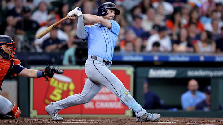 Aug 4, 2024; Houston, Texas, USA; Tampa Bay Rays second baseman Brandon Lowe (8) hits an RBI double against the Houston Astros during the third inning at Minute Maid Park.