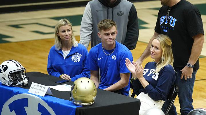 Basha safety Tommy Prassas smiles as his family claps with those in attendance for his signing with BYU during the NLI signing at Basha High School in Chandler on Dec. 20, 2023.