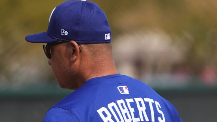 Feb 16, 2025; Glendale, AZ, USA; Los Angeles Dodgers manager Dave Roberts (30) looks on during a Spring Training workout at Camelback Ranch. Mandatory Credit: Joe Camporeale-Imagn Images