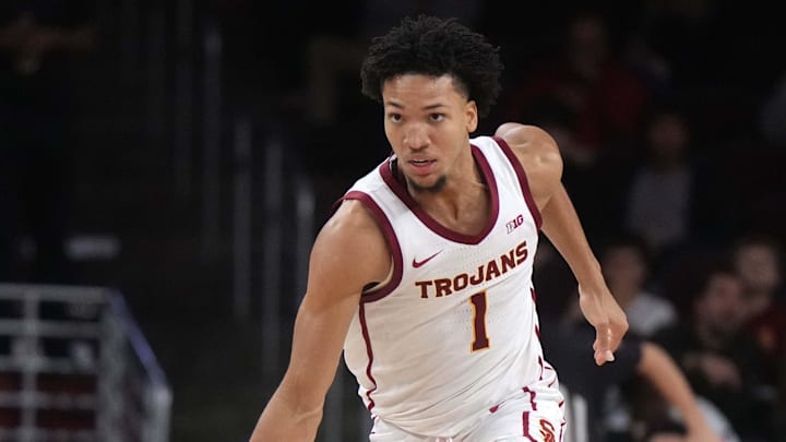 Jan 4, 2025; Los Angeles, California, USA; Southern California Trojans guard Desmond Claude (1) dribbles the ball against the Michigan Wolverines in the second half at Galen Center. Mandatory Credit: Kirby Lee-Imagn Images