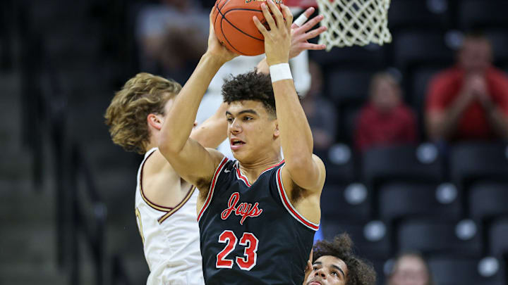 Jefferson City senior standout Jordan Martin (23), an Arkansas baseball recruit and one of the top high school baseball prospects in the state of Missouri, is averaging 32 points per game for the Jays' basketball team this season.
