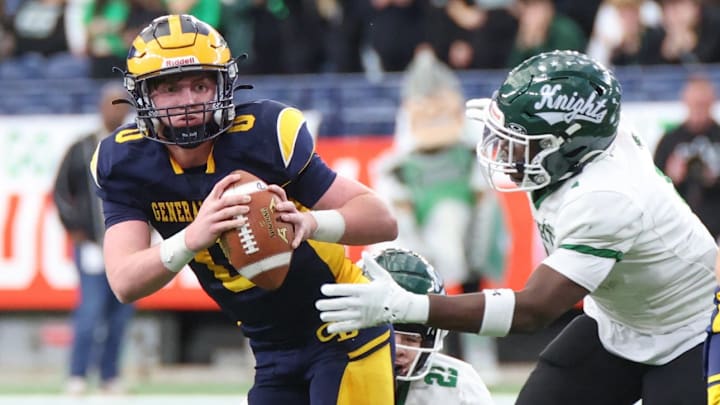 Micah Baker, right, competes for the Bishop Ludden/SAS varsity football in the Section III Class C championship game last season.