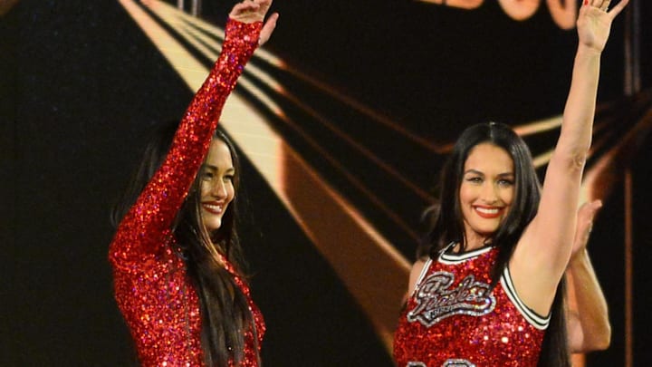 Apr 10, 2021; Tampa, Florida, USA; 2020 WWE Hall of Fame inductees Brie Bella (left) and Nikki Bella  greet fans during WrestleMania 37 at Raymond James Stadium. 