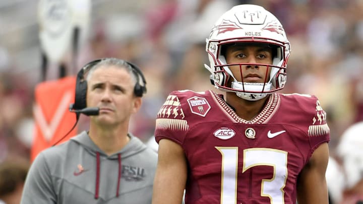 Oct 29, 2022; Tallahassee, Florida, USA; Florida State Seminoles quarterback Jordan Travis and head coach Mike Norvell during the second half against the Georgia Tech Yellow Jackets at Doak S. Campbell Stadium. Mandatory Credit: Melina Myers-Imagn Images Oct 29, 2022; Tallahassee, Florida, USA; Florida State Seminoles quarterback Jordan Travis and head coach Mike Norvell during the second half against the Georgia Tech Yellow Jackets at Doak S. Campbell Stadium. Mandatory Credit: Melina Myers-Imagn Images
