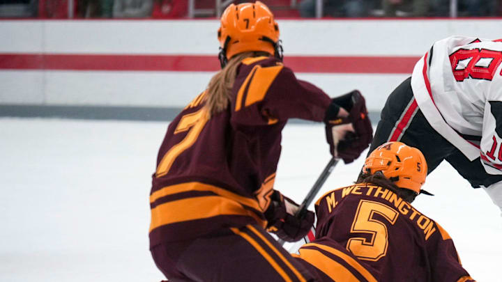 Oct 29, 2022; Columbus, Ohio, USA;  Ohio State University defenseman Sophie Jaques (18) fights with University of Minnesota defenseman Madeline Wethington (5) and defenseman Nelli Laitinen (7) for the puck during the second period at Ohio State Ice Rink. Mandatory Credit: Joseph Scheller-The Columbus Dispatch

Hockey Osu Women Hockey