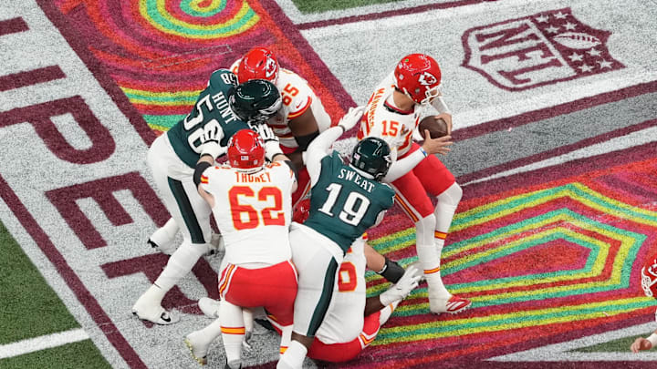 Feb 9, 2025; New Orleans, LA, USA; Kansas City Chiefs quarterback Patrick Mahomes (15) is pressured by Philadelphia Eagles linebacker Josh Sweat (19) in the second quarter during Super Bowl LIX at Caesars Superdome. Mandatory Credit: James Lang-Imagn Images