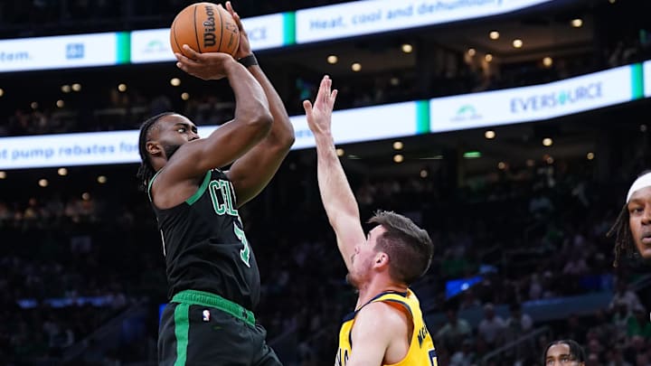 May 23, 2024; Boston, Massachusetts, USA; Boston Celtics guard Jaylen Brown (7) shoots the ball against Indiana Pacers guard T.J. McConnell (9) in the first half during game two of the eastern conference finals for the 2024 NBA playoffs at TD Garden. Mandatory Credit: David Butler II-Imagn Images