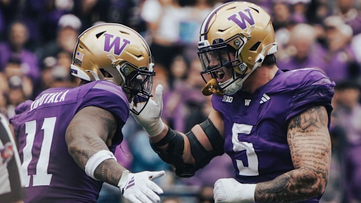 Alphonzo Tuputala and Zach Durfee celebrate a defensive stop. 