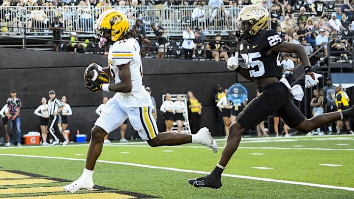 Sep 30, 2023; Nashville, Tennessee, USA;  Missouri Tigers wide receiver Marquis Johnson (17) scores late against the Vanderbilt Commodores during the second half at FirstBank Stadium. Mandatory Credit: Steve Roberts-Imagn Images