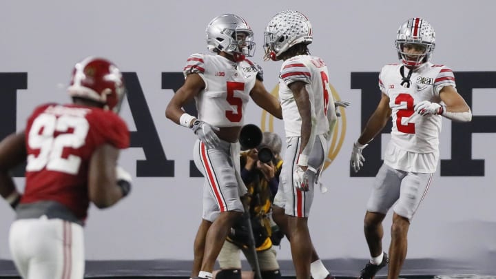 Jan. 11, 2021; Miami Gardens, Florida, USA; Ohio State Buckeyes wide receiver Garrett Wilson (5) celebrates catching a 20-yard touchdown with wide receiver Jameson Williams (6) during the third quarter of the College Football Playoff National Championship against the Alabama Crimson Tide at Hard Rock Stadium in Miami Gardens, Fla. Mandatory Credit: Kyle Robertson/The Columbus Dispatch/USA TODAY Network

Ncaa Football Cfp National Championship Ohio State Vs Alabama