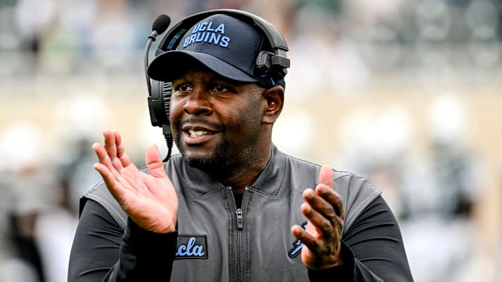 UCLA interim head coach Tim Skipper celebrates after a Bruins touchdown against Michigan State at Spartan Stadium.