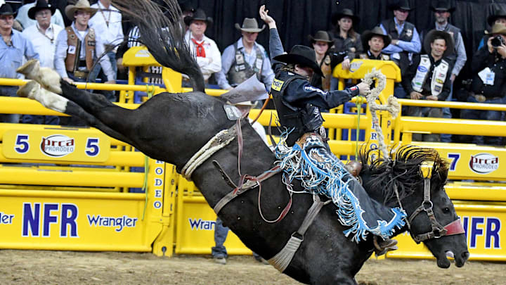 Dec 10, 2016; Las Vegas, NV, USA; Saddle bronc rider Ryder Wright competes  on the final night of the National Finals Rodeo at Thomas & Mack Center. Mandatory Credit: Stephen R. Sylvanie-Imagn Images 