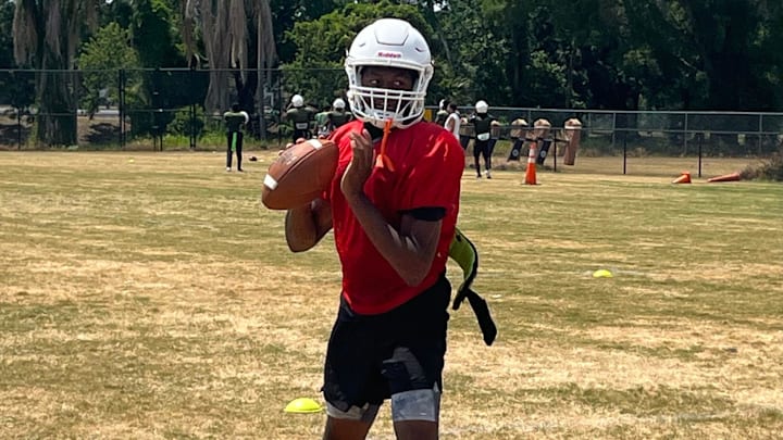 Jones quarterback Dereon Coleman sets up to throw during practice Friday in Orlando.