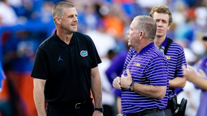 Florida Gators head coach Billy Napier and LSU Tigers head coach Brian Kelly talk before the game at Steve Spurrier Field at Ben Hill Griffin Stadium in Gainesville, FL on Saturday, October 15, 2022. [Matt Pendleton/Gainesville Sun].