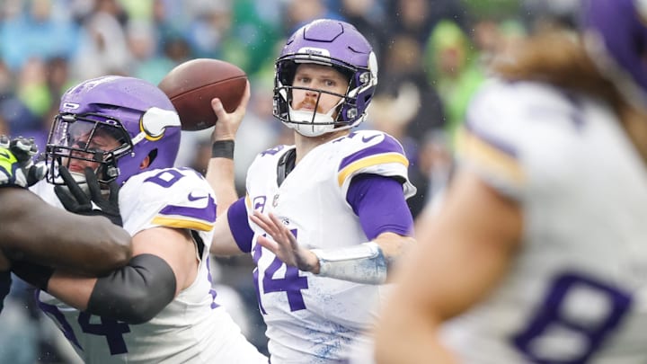 Sam Darnold (14) passes against the Seattle Seahawks during the first quarter at Lumen Field. Sam Darnold (14) passes against the Seattle Seahawks during the first quarter at Lumen Field.