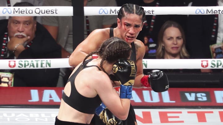 Amanda Serrano (red gloves) fights Katie Taylor(blue gloves) at AT&T Stadium. Amanda Serrano (red gloves) fights Katie Taylor(blue gloves) at AT&T Stadium.