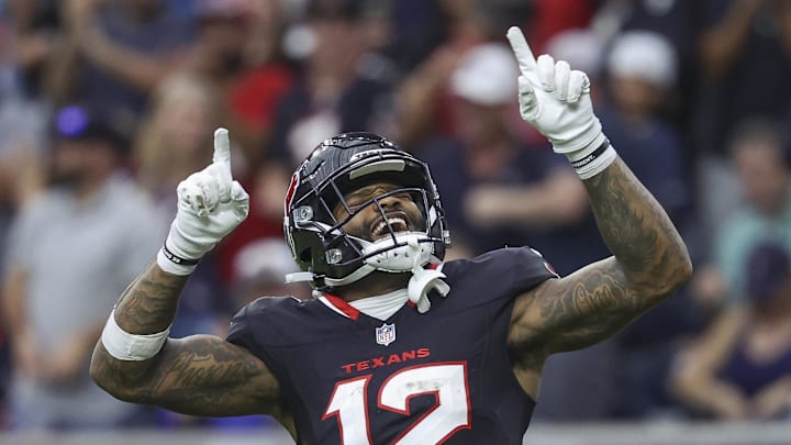 Nov 24, 2024; Houston, Texas, USA; Houston Texans wide receiver Nico Collins (12) celebrates after a reception during the second quarter against the Tennessee Titans at NRG Stadium. Mandatory Credit: Troy Taormina-Imagn Images