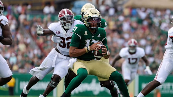 Sep 16, 2023; Tampa, Florida, USA;  South Florida Bulls quarterback Byrum Brown (17) is pressured by Alabama Crimson Tide linebacker Deontae Lawson (32) in the first quarter at Raymond James Stadium. Mandatory Credit: Nathan Ray Seebeck-USA TODAY Sports