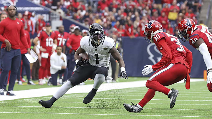 Nov 26, 2023; Houston, Texas, USA; Jacksonville Jaguars running back Travis Etienne Jr. (1) runs