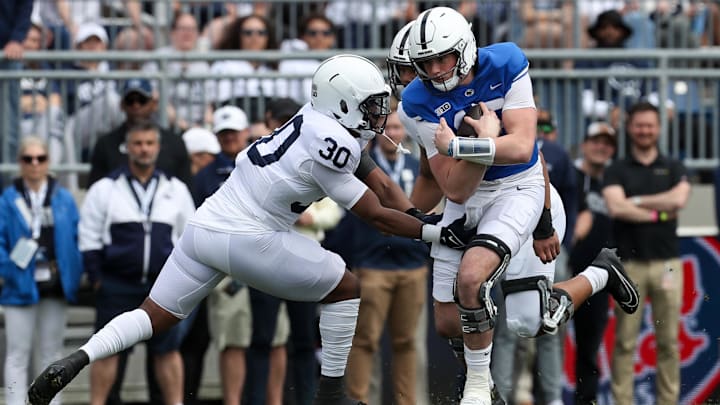 Penn State football quarterback Drew Allar running the ball in the Blue White spring game