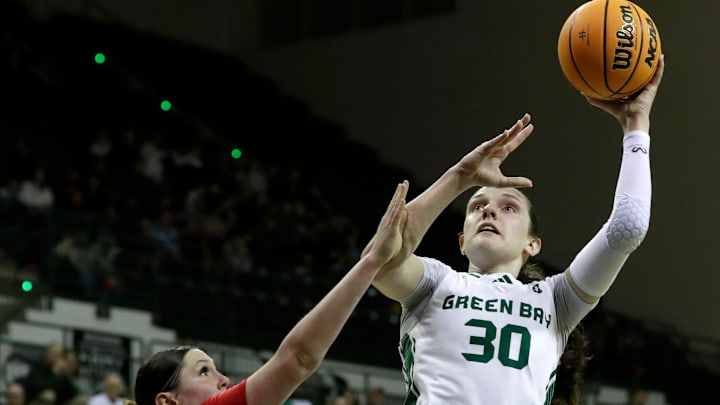University of Wisconsin-Green Bay's Jenna Guyer (30) shoots the ball during a game against Detroit in the first round of the Horizon League Tournament on March 4, 2026 at the Kress Center in Green Bay, Wis. UW-Green Bay defeated Detroit 81-57.
