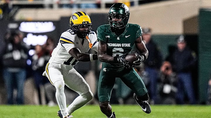 Michigan defensive back Zeke Berry (10) tackles Michigan State wide receiver Nick Marsh (6) during the first half at Spartan Stadium in East Lansing on Saturday, October 25, 2025. Michigan defensive back Zeke Berry (10) tackles Michigan State wide receiver Nick Marsh (6) during the first half at Spartan Stadium in East Lansing on Saturday, October 25, 2025.