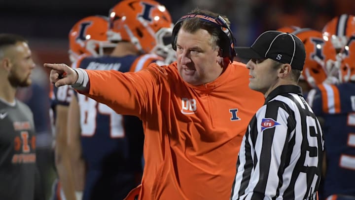 Oct 6, 2023; Champaign, Illinois, USA; Illinois Fighting Illini head coach Bret Bielema talks with an official during the first half against the Nebraska Cornhuskers at Memorial Stadium. Mandatory Credit: Ron Johnson-USA TODAY Sports