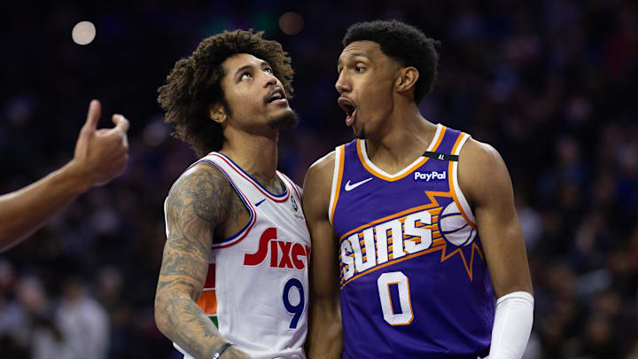 Jan 6, 2025; Philadelphia, Pennsylvania, USA; Philadelphia 76ers guard Kelly Oubre Jr. (9) reacts next to Phoenix Suns forward Ryan Dunn (0) after a missed shot during the second quarter at Wells Fargo Center. Mandatory Credit: Bill Streicher-Imagn Images