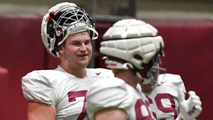 April 9, 2024; Tuscaloosa, Alabama, USA; Alabama offensive lineman Wilkin Formby (75) smiles at a teammate during practice in the Hank Crisp Indoor Practice Facility at the University of Alabama.