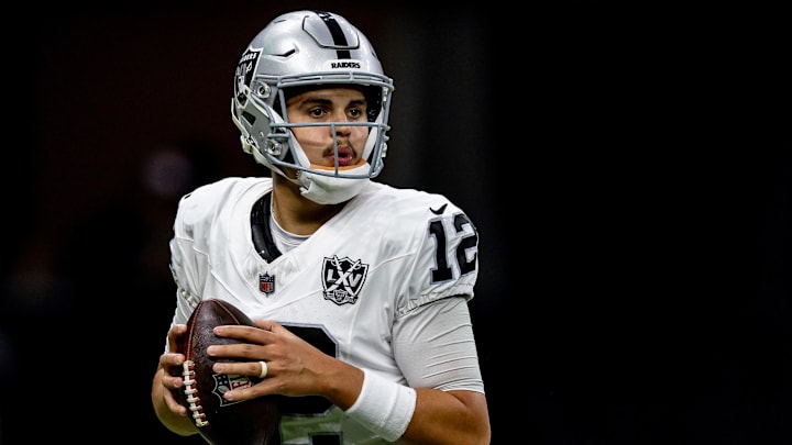 Dec 29, 2024; New Orleans, Louisiana, USA;  Las Vegas Raiders quarterback Aidan O'Connell (12) drops back to pass against the New Orleans Saints during the first half at Caesars Superdome. Mandatory Credit: Stephen Lew-Imagn Images