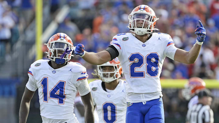 Nov 2, 2024; Jacksonville, Florida, USA; Florida Gators defensive back Devin Moore (28) celebrates after an interception against the Georgia Bulldogs during the first half at EverBank Stadium. Mandatory Credit: Melina Myers-Imagn Images