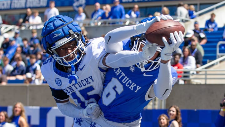 Kentucky wide receiver Dane Key (5) hauled in a touchdown over defensive back Jeremiah Anglin, Jr. (15) during the Kentucky Wildcats' Blue White scrimmage at Kroger Field on Saturday afternoon in Lexington, Kentucky. April 13, 2024 Kentucky wide receiver Dane Key (5) hauled in a touchdown over defensive back Jeremiah Anglin, Jr. (15) during the Kentucky Wildcats' Blue White scrimmage at Kroger Field on Saturday afternoon in Lexington, Kentucky. April 13, 2024