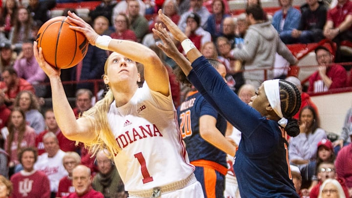 Indiana's Lexus Bargesser (1) shoots over Illinois' Genesis Bryant (1) and Kendall Bostic (44) during the Indiana versus Illinois women's basketball game at Simon Skjodt Assembly Hall on Thursday, Jan. 16, 2025.
