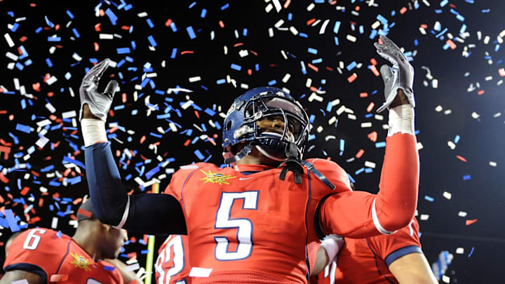 Dec 20, 2008; Las Vegas, NV, USA; Arizona Wildcats running back Nic Grigsby (5) celebrates after the Wildcats' 31-21 victory over the Brigham Young Cougars in the Las Vegas Bowl at Sam Boyd Stadium. Mandatory Credit: Kirby Lee/Image of Sport-Imagn Images Dec 20, 2008; Las Vegas, NV, USA; Arizona Wildcats running back Nic Grigsby (5) celebrates after the Wildcats' 31-21 victory over the Brigham Young Cougars in the Las Vegas Bowl at Sam Boyd Stadium. Mandatory Credit: Kirby Lee/Image of Sport-Imagn Images