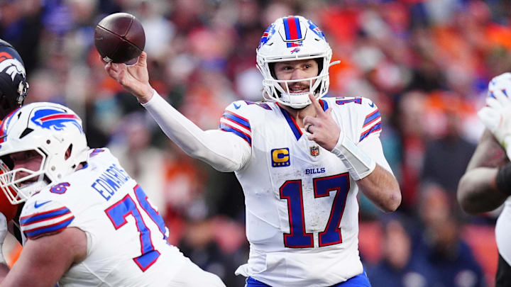 Buffalo Bills quarterback Josh Allen (17) throws a touchdown pass during the third quarter of an AFC Divisional Round playoff game against the Denver Broncos at Empower Field at Mile High.