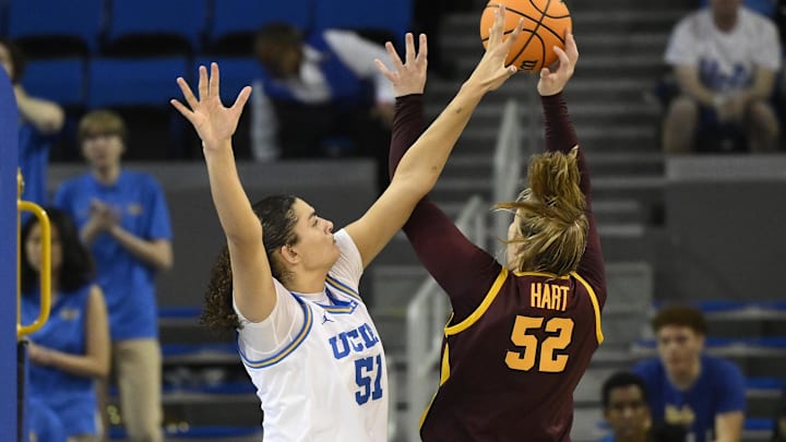 Feb 2, 2025; Los Angeles, California, USA; UCLA Bruins center Lauren Betts (51) tries to block a shot by Minnesota Golden Gophers center Sophie Hart (52) during the fourth quarter at Pauley Pavilion presented by Wescom. Mandatory Credit: Robert Hanashiro-Imagn Images