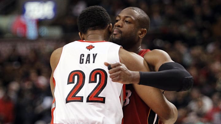 Mar 17, 2013; Toronto, Ontario, CAN; Toronto Raptors forward Rudy Gay (22) and Miami Heat guard Dwyane Wade (3) hug at the start of the first half at the Air Canada Centre. Mandatory Credit: John E. Sokolowski-Imagn Images