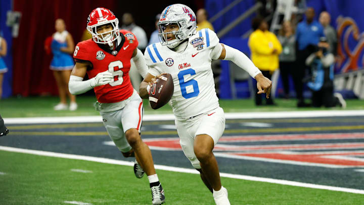Jan 1, 2026; New Orleans, LA, USA; Mississippi Rebels quarterback Trinidad Chambliss (6) scrambles with the ball under pressure from Georgia Bulldogs defensive back Daylen Everette (6) in the fourth quarter during the 2025 Sugar Bowl and quarterfinal game of the College Football Playoff at Caesars Superdome. Mandatory Credit: Geoff Burke-Imagn Images