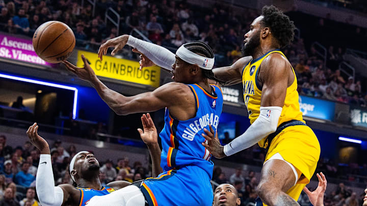Mar 31, 2023; Indianapolis, Indiana, USA; Oklahoma City Thunder guard Shai Gilgeous-Alexander (2) and Indiana Pacers forward Oshae Brissett (12) fight for a rebound in the second quarter at Gainbridge Fieldhouse. Mandatory Credit: Trevor Ruszkowski-Imagn Images Mar 31, 2023; Indianapolis, Indiana, USA; Oklahoma City Thunder guard Shai Gilgeous-Alexander (2) and Indiana Pacers forward Oshae Brissett (12) fight for a rebound in the second quarter at Gainbridge Fieldhouse. Mandatory Credit: Trevor Ruszkowski-Imagn Images