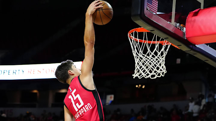 Jul 14, 2024; Las Vegas, NV, USA; Houston Rockets guard Reed Sheppard (15) dunks against the Washington Wizards during the third quarter at Thomas & Mack Center. Mandatory Credit: Stephen R. Sylvanie-Imagn Images